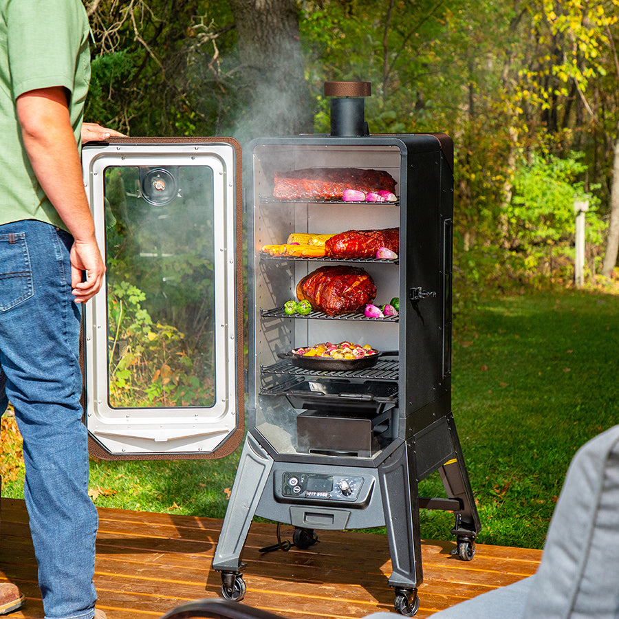 Pit Boss Copperhead 3 Series Wood Pellet Vertical Smoker, Mahogany Color. Smoking meats and veggies inside smoker on home porch