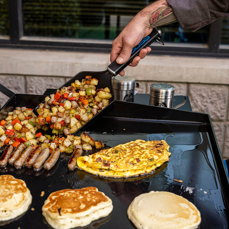 Ultimate Griddle Grub Shovel scooping up breakfast scramble hashbrowns